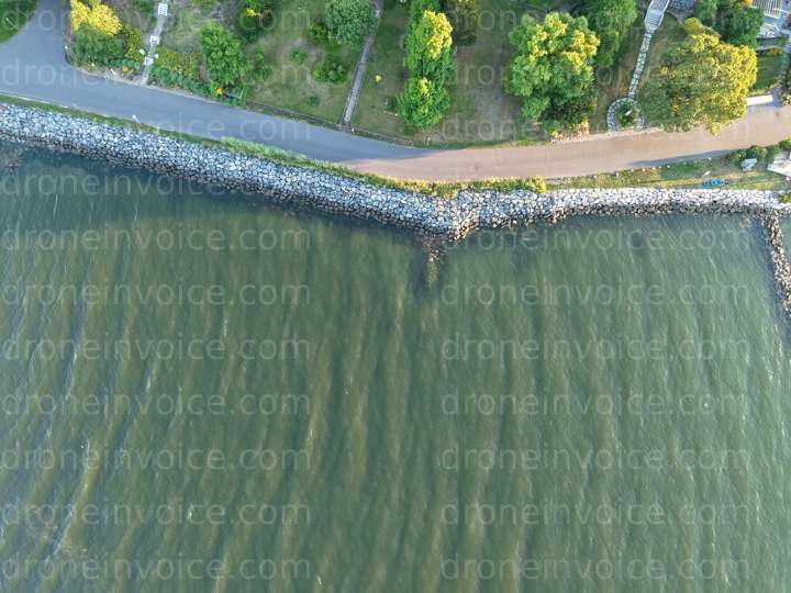 Cover for Coastal road along breakwater