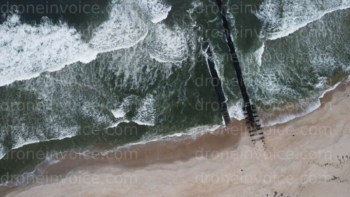 Cover for White Capped Ocean Waves at Beach with Jetty
